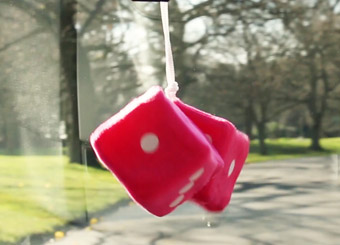 Fluffy dice hanging in the widscreen